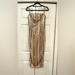 Silver/gold sequins midi dress with straps. Size small runs small. Fully lined.